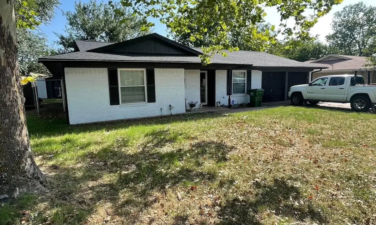 Professional roofing crew working on a residential roof in Chester